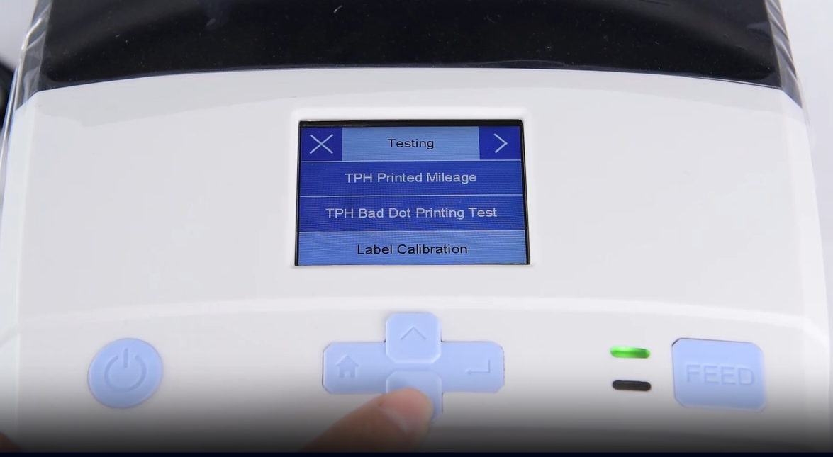 A close-up of a machine's digital interface showing a testing menu.